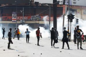 Demonstrators gesture as police use tear gas to disperse protesters during a demonstration against Kenya's proposed finance bill 2024/2025 in Nairobi, Kenya, June 25, 2024. REUTERS/Monicah Mwangi