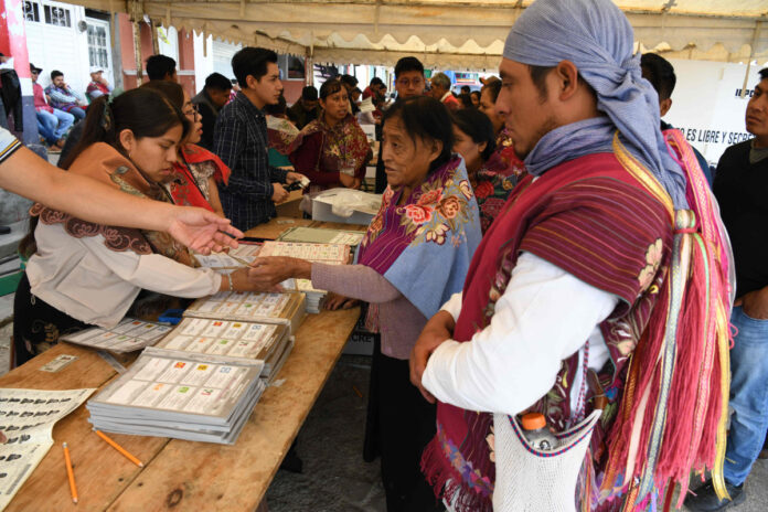 Indigenous Tzotzil people vote during the general election in Zinacantan, Chiapas state, Mexico, on June 2, 2024. (AFP)