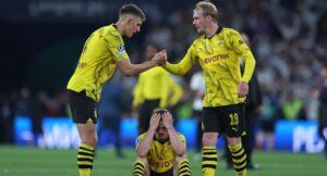 (From L) Dortmund’s German defender #04 Nico Schlotterbeck, Dortmund’s Austrian midfielder #20 Marcel Sabitzer, and Dortmund’s German midfielder #19 Julian Brandt react after loosing at the end of the UEFA Champions League final football match between Borussia Dortmund and Real Madrid, at Wembley stadium, in London, on June 1, 2024. (Photo by Adrian DENNIS / AFP)