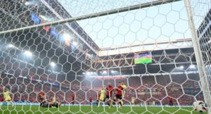 Spain’s forward #11 Ferran Torres (Rear L) scores his team’s first goal past Albania’s goalkeeper #23 Thomas Strakosha (L) during the UEFA Euro 2024 Group B football match between Albania and Spain at the Duesseldorf Arena in Duesseldorf on June 24, 2024. (Photo by Ina FASSBENDER / AFP)