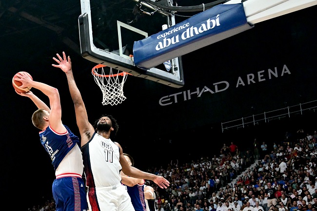 Serbia’s centre #15 Nikola Jokic (L) fights for the ball against US centre #11 Joel Embiid during the Basketball Showcase friendly match between the United States and Serbia the at Etihad Arena in Abu Dhabi on July 17, 2024. (Photo by Giuseppe CACACE / AFP)