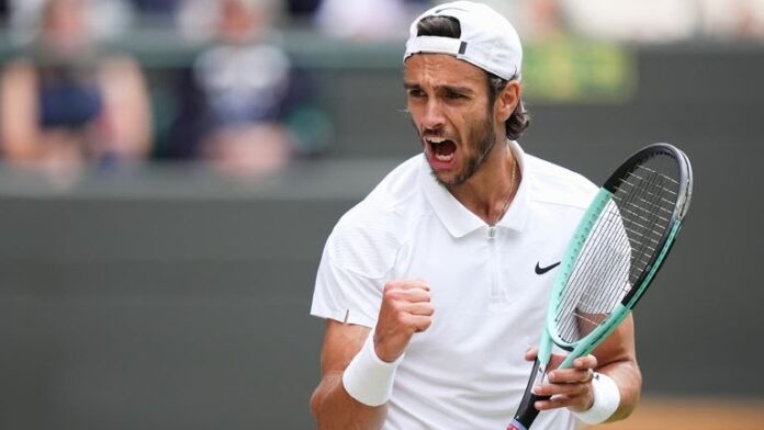 Image:Lorenzo Musetti is through to the first Grand Slam semi-final of his career after a five-set victory over Taylor Fritz
