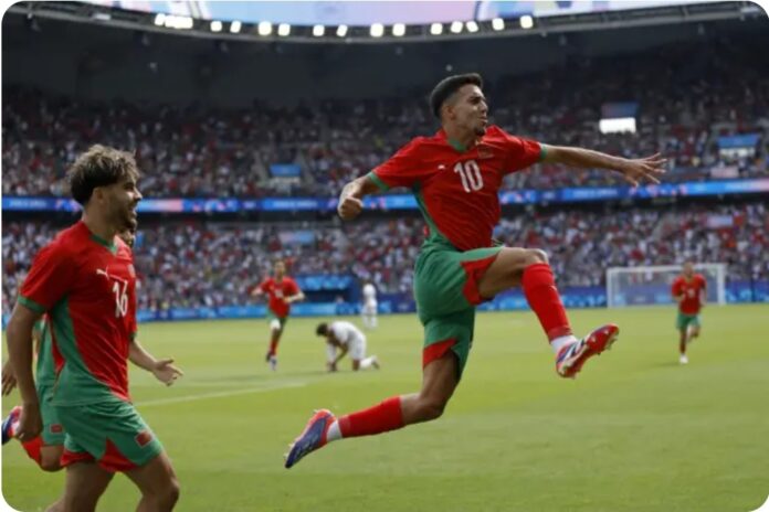 Ilias Akhomach celebrates after scoring Morocco’s second goal in the Paris Olympics quarterfinal match against the US on Friday. (AP pic)
