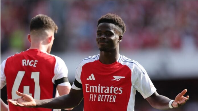 Arsenal's Bukayo Saka celebrates after scoring their second goal during their Premier League football match against Wolverhampton Wanderers at the Emirates Stadium in London on Saturday. Photo: Adrian Dennis/AFP