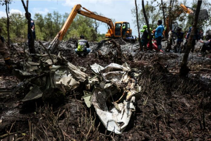 Rescue workers search the wreckage of a small aircraft a day after it crashed as five tourists from China and four Thais, including the two pilots, all presumed dead, in Bang Pakong, Chachoengsao province, Thailand, August 23, 2024