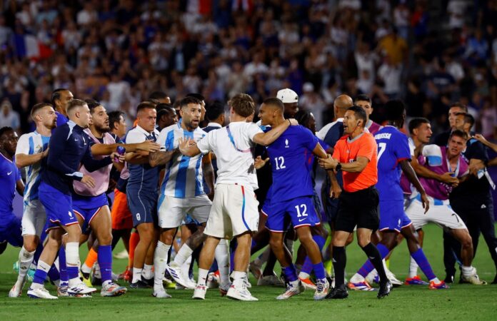 france-argentina France and Argentina players and staffs react at the end of the match men's quarter-final football match at the Bordeaux Stadium in Bordeaux on August 2, 2024. PHOTO: REUTERS