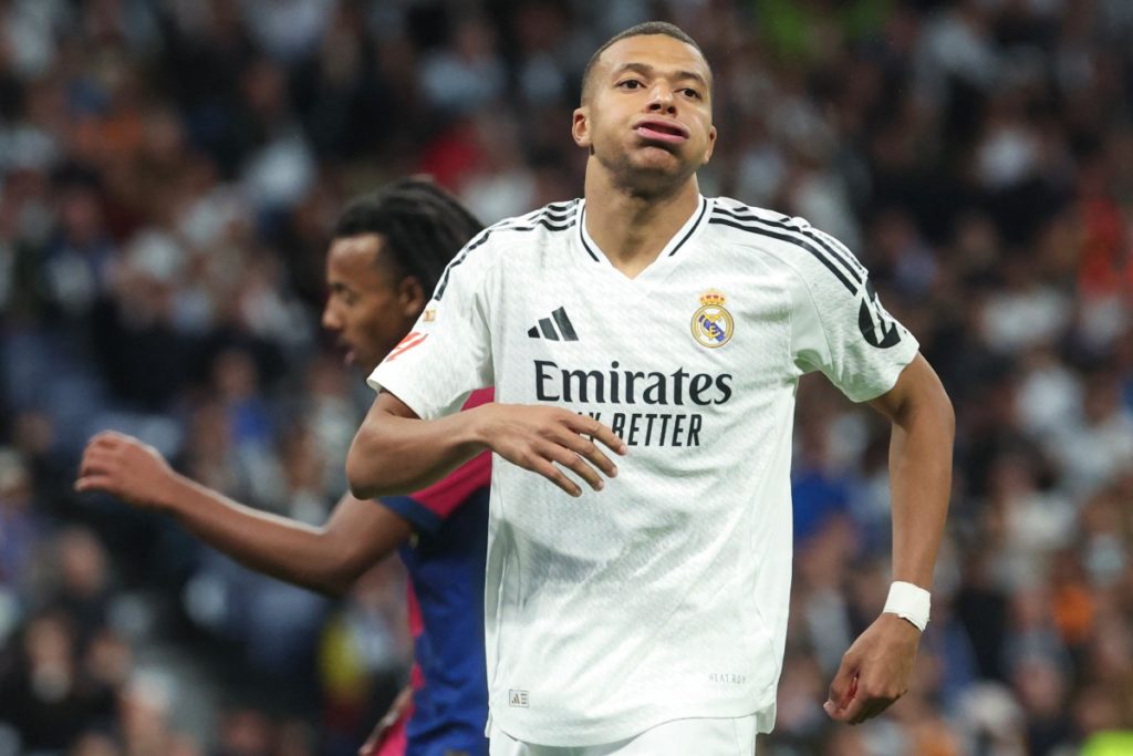 Real Madrid’s French forward #09 Kylian Mbappe gestures during the Spanish league football match between Real Madrid CF and FC Barcelona at the Santiago Bernabeu stadium in Madrid on October 26, 2024. (Photo by Pierre-Philippe MARCOU / AFP)