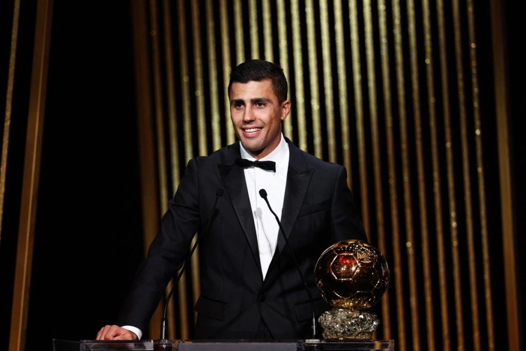 Manchester City’s Spanish midfielder Rodri receives the Ballon d’Or award during the 2024 Ballon d’Or France Football award ceremony at the Theatre du Chatelet in Paris on October 28, 2024. (Photo by FRANCK FIFE / AFP)