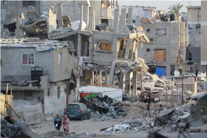 At least 28 dead in Gaza strike on school-turned-shelter People walk past destroyed buildings in Khan Yunis in the southern Gaza Strip on October 17th. Photograph: Bashar Taleb/AFP via Getty