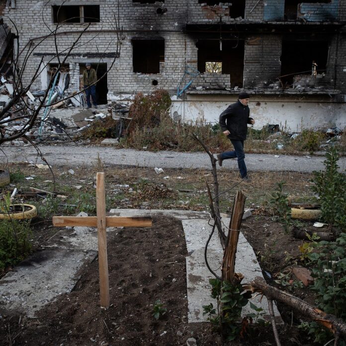 A resident running between buildings during a Russian mortar attack on Siversk, in eastern Ukraine, this week.Credit...Tyler Hicks/The New York Times