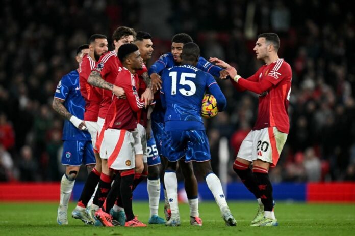 Players argue over the ball during the English Premier League football match between Manchester United and Chelsea at Old Trafford in Manchester, north west England, on November 3, 2024. (Photo by Paul ELLIS / AFP) 