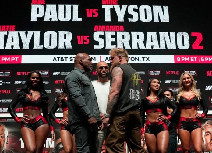 US boxer Mike Tyson (L) and US boxer-actor Jake Paul (R) face each other during a press conference ahead of their heavyweight bout at The Pavilion at Toyota Music Factory in Irving, Texas, on November 13, 2024. (Photo by TIMOTHY A. CLARY / AFP)