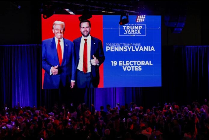 A projection regarding Pennsylvania's electoral votes is shown at Republican presidential nominee and former U.S. President Donald Trump's election night watch party in Palm Beach County Convention Center, in West Palm Beach, Florida, U.S., November 6, 2024. REUTERS/Brendan McDermid