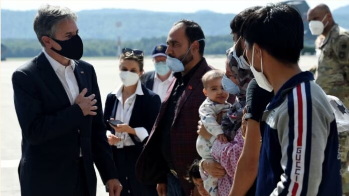 US secretary of state Antony Blinken, left, meets Afghan refugees on Wednesday at Ramstein military base in Germany, where international talks on the Taliban are due to take place © Olivier Douliery/Pool/Reuters