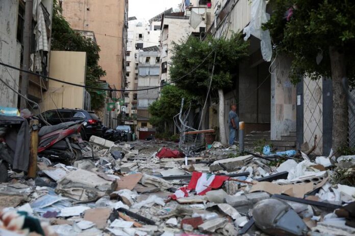 A man stands at the site of an Israeli strike on central Beirut's Bachoura neighbourhood, amid ongoing hostilities between Hezbollah and Israeli forces, in Beirut, Lebanon October 3, 2024. EMILIE MADI / REUTERS