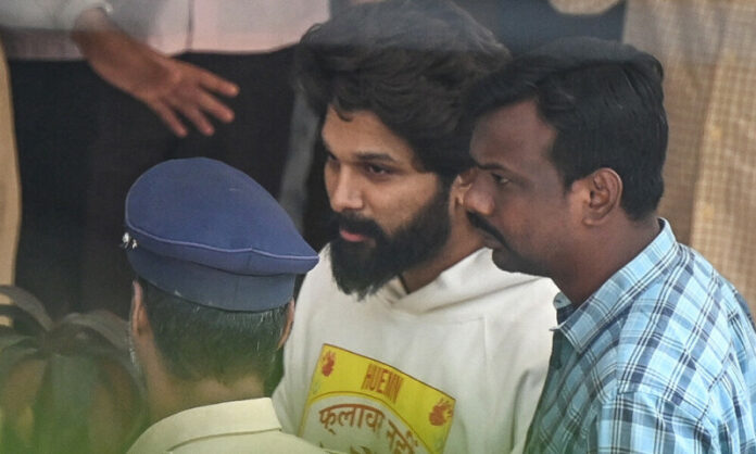 An Indian actor was arrested Friday after his appearance at a movie screening allegedly prompted a stampede by fans that crushed a woman to death, police and local media said.