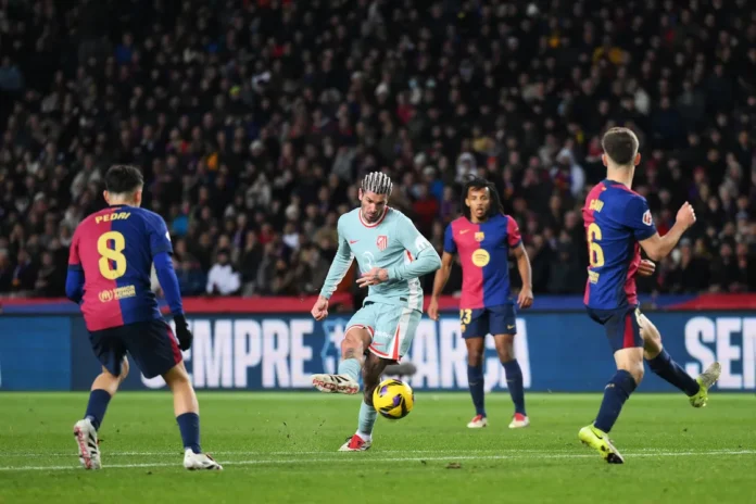 De Paul scores against Barca. Photo by David Ramos/Getty Images
