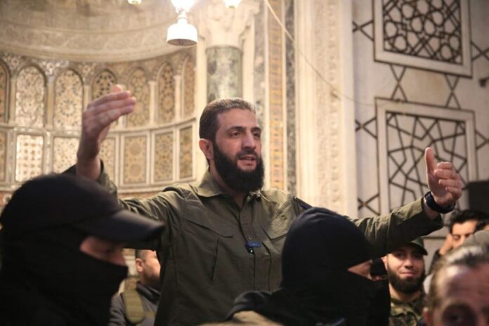Ahmad Al Sharaa addresses a crowd at Umayyad Mosque in Damascus in the immediate aftermath of the fall of Assad’s regime on Dec. 8, 2024. Aref TAMMAWI/AFP via Getty Images