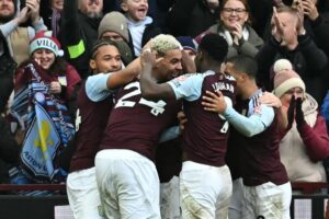 Aston Villa’s English midfielder #27 Morgan Rogers (C) celebrates with teammates after scoring their second goal during the English Premier League football match between Aston Villa and Manchester City at Villa Park in Birmingham, central England on December 21, 2024. (Photo by Paul ELLIS / AFP).