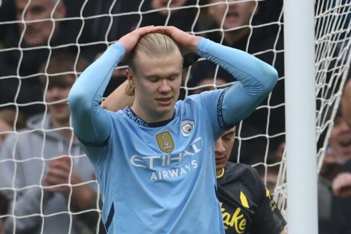 Manchester City’s Erling Haaland reacts after having his penalty saved by Everton’s English goalkeeper #01 Jordan Pickford during the English Premier League football match between Manchester City and Everton at the Etihad Stadium in Manchester, north west England, on December 26, 2024. (Photo by Darren Staples / AFP)
