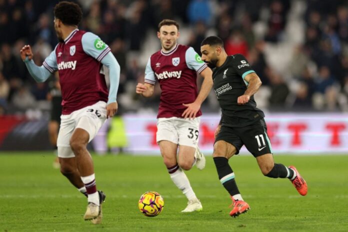 Liverpool’s Egyptian striker #11 Mohamed Salah runs with the ball during the English Premier League football match between West Ham United and Liverpool at the London Stadium, in London on December 29, 2024. (Photo by Adrian Dennis / AFP)  Liverpool’s Egyptian striker #11 Mohamed Salah runs with the ball during the English Premier League football match between West Ham United and Liverpool at the London Stadium, in London on December 29, 2024. (Photo by Adrian Dennis / AFP)