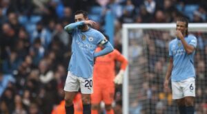 Manchester City’s Portuguese midfielder #20 Bernardo Silva (C) reacts to conceding their first goal during the English Premier League football match between Manchester City and Everton at the Etihad Stadium in Manchester, north west England, on December 26, 2024. (Photo by Darren Staples / AFP)