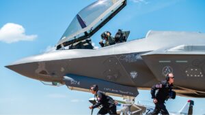 F-35 Lightning II demonstration team members sprint to their positions during the ground show at the Defenders of Liberty Air & Space Show at Barksdale Air Force Base, La., May 17, 2019. The team’s ground show consists of pre-flight inspections with sharp, quick-paced movements that showcase the pride and professionalism of the U.S. Air Force. (U.S. Air Force photo by Senior Airman Alexander Cook)