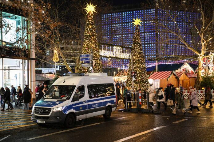A police car secures an entrance of the Christmas market on the Breitscheidplatz, after a car rammed into a crowd of people at the Magdeburg Christmas market, in Berlin, Germany December 21, 2024. REUTERS/Annegret Hilse