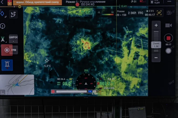 Image on the live stream screen of a night vision drone operating near Pokrovsk, Ukraine. Enemy Russian target detected. Anton Shtuka for NPR