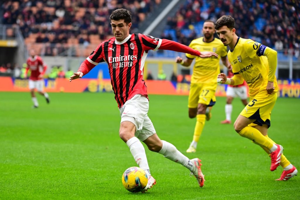 AC Milan’s US forward #11 Christian Pulisic (L) controls the ball next to Parma’s Italian defender #15 Enrico Delprato (R) during the Italian Serie A football match between AC Milan and Parma at the San Siro Stadium in Milan, on January 26, 2025. (Photo by Piero CRUCIATTI / AFP)
