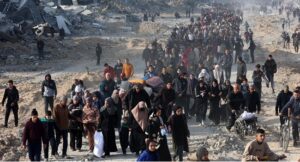  Scores of displaced Palestinians walk along a road in the Saftawi area of Jabalia, as they leave areas near Gaza City where they had taken refuge, toward the further northern part of the Gaza Strip, shortly after a ceasefire deal in the war between Israel and the Palestinian militant group Hamas was expected to be implemented. (Photo by Omar AL-QATTAA / AFP)