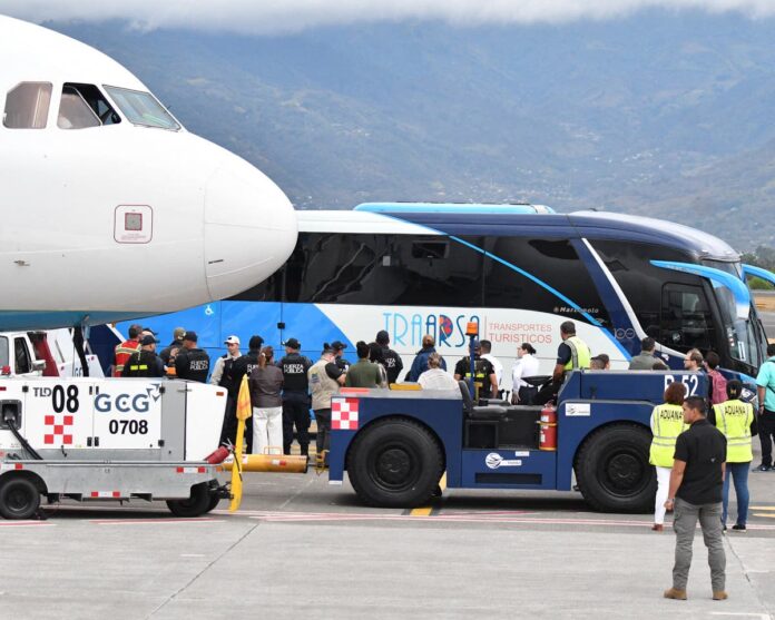 A bus carrying migrants deported from the United States leaving the Juan Santamaría International Airport outside the Costa Rican capital of San José on Thursday.Credit...Ezequiel Becerra/Agence France-Presse — Getty Images