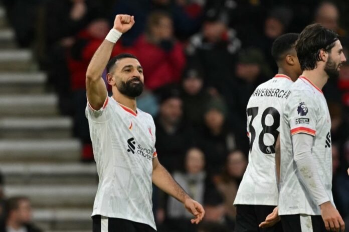 Liverpool’s Egyptian striker #11 Mohamed Salah (L) celebrates after scoring their second goal during the English Premier League football match between Bournemouth and Liverpool at the Vitality Stadium in Bournemouth, southern England on February 1, 2025. (Photo by Glyn KIRK / AFP) / RESTRICTED TO EDITORIAL USE. NO USE WITH UNAUTHORIZED AUDIO, VIDEO, DATA, FIXTURE LISTS, CLUB/LEAGUE LOGOS OR ‘LIVE’ SERVICES. ONLINE IN-MATCH USE LIMITED TO 120 IMAGES. AN ADDITIONAL 40 IMAGES MAY BE USED IN EXTRA TIME. NO VIDEO EMULATION. SOCIAL MEDIA IN-MATCH USE LIMITED TO 120 IMAGES. AN ADDITIONAL 40 IMAGES MAY BE USED IN EXTRA TIME. NO USE IN BETTING PUBLICATIONS, GAMES OR SINGLE CLUB/LEAGUE/PLAYER PUBLICATIONS.