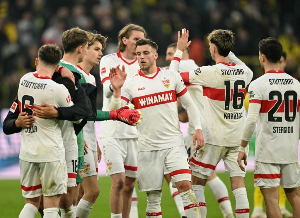 Stuttgart’s players celebrate after the German first division Bundesliga football match between Borussia Dortmund and VfB Stuttgart in Dortmund on February 8, 2025. (Photo by INA FASSBENDER / AFP) /