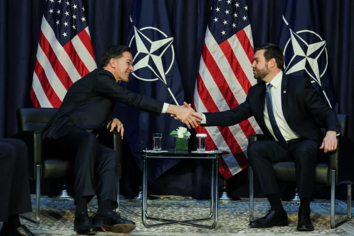 U.S. Vice President JD Vance shakes hands as he participates in a bilateral meeting with NATO Secretary General Mark Rutte at the Commerzbank in Munich, Germany, February 14, 2025. REUTERS/Leah Millis 
