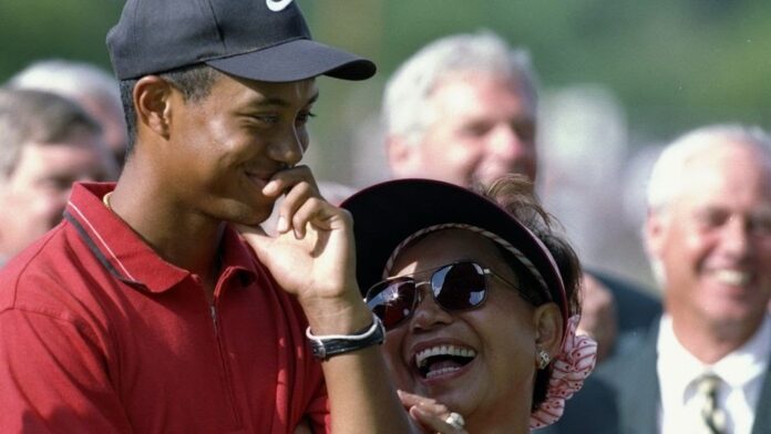 6 Jul 1997: Tiger Woods (left) smiles with his mother Kultida Woods (right) during the Motorola Western Open at the Cog Hill Country Club in Lemont, Illinois. Mandatory Credit: Andy Lyons /Allsport