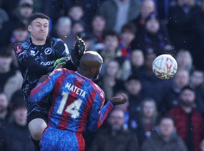 Soccer Football - FA Cup - Fifth Round - Crystal Palace v Millwall - Selhurst Park, London, Britain - March 1, 2025 Millwall's Liam Roberts fouls Crystal Palace's Jean-Philippe Mateta and is later sent off REUTERS/David Klein 