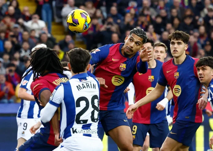 Soccer Football - LaLiga - FC Barcelona v Real Sociedad - Estadi Olimpic Lluis Companys, Barcelona, Spain - March 2, 2025 FC Barcelona's Ronald Araujo scores their third goal REUTERS/Albert Gea