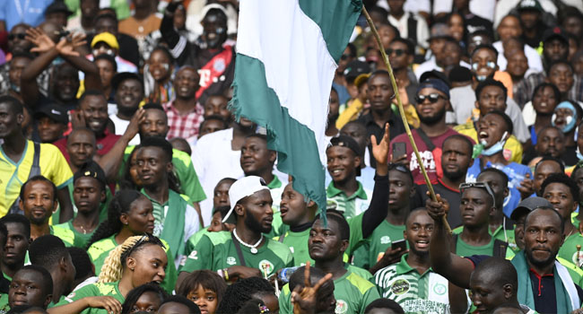Nigerian fans cheer during the World Cup 2022 qualifying football match between Nigeria and Ghana at the National Stadium in Abuja on March 29, 2022. Pius Utomi EKPEI / AFP