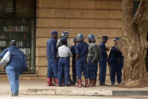 Riot police officers gather on a deserted street in downtown Harare, Zimbabwe, on Monday, March 31, 2025, following calls for an antigovernment protest [Aaron Ufumeli/AP Photo]