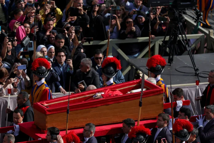 Pope Francis' body is carried in a coffin into Saint Peter's Basilica on the day of its translation, at the Vatican, April 23, 2025. REUTERS/Claudia Greco 