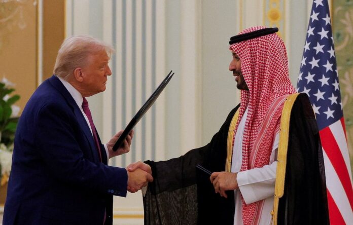 President Donald Trump and Saudi Crown Prince and Prime Minister Mohammed Bin Salman shake hands during a Memorandum of Understanding (MOU) signing ceremony at the Royal Court in Riyadh, Saudi Arabia, May 13, 2025. REUTERS/Brian Snyder 