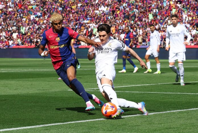 Soccer Football - LaLiga - FC Barcelona v Real Madrid - Estadi Olimpic Lluis Companys, Barcelona, Spain - May 11, 2025 FC Barcelona's Lamine Yamal in action with Real Madrid's Fran Garcia REUTERS/Albert Gea Purchase Licensing Rights, opens new tab