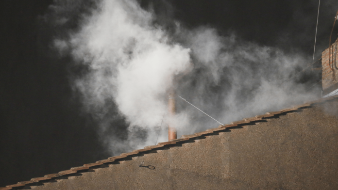 White smoke from the roof of the Sistine Chapel on March 13th, 2013, indicating the election of Cardinal Jorge Mario Bergoglio as Roman Pontiff with the name of Pope Francis I