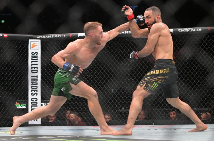 May 10, 2025; Montreal, Quebec, CANADA; Belal Muhammad (red gloves) fights Jack Della Maddalena (blue gloves) during UFC 315 at Bell Centre. Eric Bolte-Imagn Images
