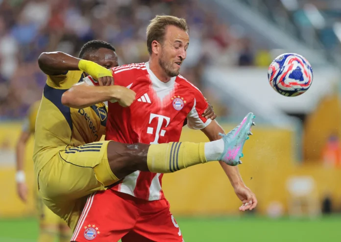 FIFA Club World Cup - Group C - Bayern Munich v Boca Juniors - Hard Rock Stadium, Miami Gardens, Florida, U.S. - June 20, 2025 Bayern Munich's Harry Kane in action with Boca Juniors' Luis Advincula IMAGN IMAGES via Reuters/Sam Navarro