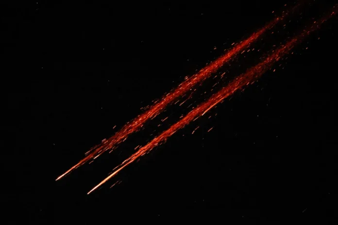 Missiles launched from Iran towards Israel are seen from Tubas, in the Israeli-occupied West Bank, June 14, 2025. REUTERS/Raneen Sawafta