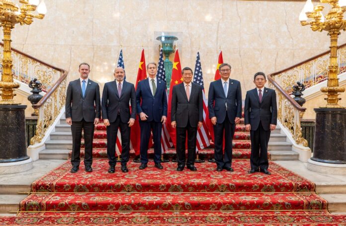 U.S. Treasury Secretary Scott Bessent and Chinese vice premier He Lifeng pose for a photo with U.S. Trade Representative Jamieson Greer, U.S. Secretary of Commerce Howard Lutnick, Chinese Commerce Minister Wang Wentao, and China's International Trade Representative and Vice Minister of Commerce Li Chenggang, in London, Britain June 9, 2025. United States Treasury/Handout via REUTERS/File Photo