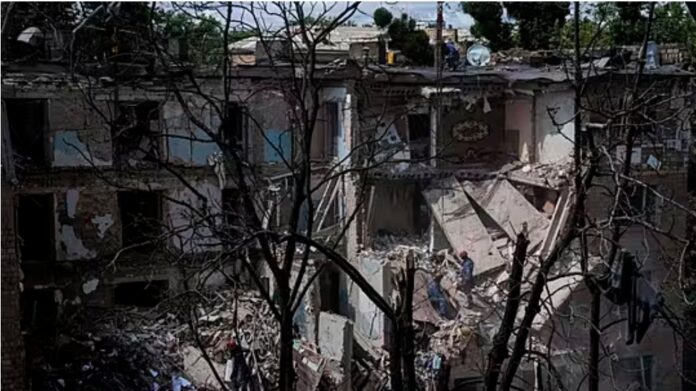 Rescue workers clear the rubble of a residential house destroyed by a Russian strike in Kyiv, Ukraine, © Copyright 2025 The Associated Press. All rights reserved