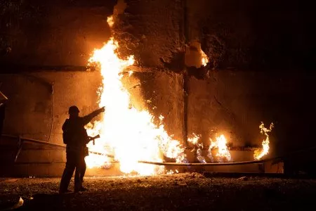 File photo: A firefighter stands by a fire and points to a hole following a drone strike in Kharkiv, Ukraine, on June 5, 2025. OLEKSANDR MAGULA/Getty Images File photo: A firefighter stands by a fire and points to a hole following a drone strike in Kharkiv, Ukraine, on June 5, 2025. OLEKSANDR MAGULA/Getty Images